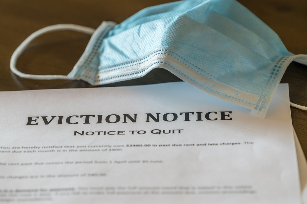 Defaulting,Renter,With,Facemask,Receives,Letter,Giving,Notice,Of,Eviction